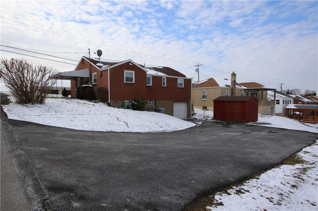 152 Taylor Run Road Monongahela, PA 15063 - Photo 22 of 25 Newer Asphalt Driveway (2017) allowing 8-10 Vehicles for Off Street Parking outside of Newer Garage Door w/ Insulated Clopay Winter Door 2014 Also Newer Soffit, Facia, Gutters & Downspouts 2017