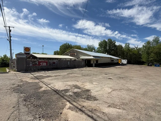 a view of the house with a yard