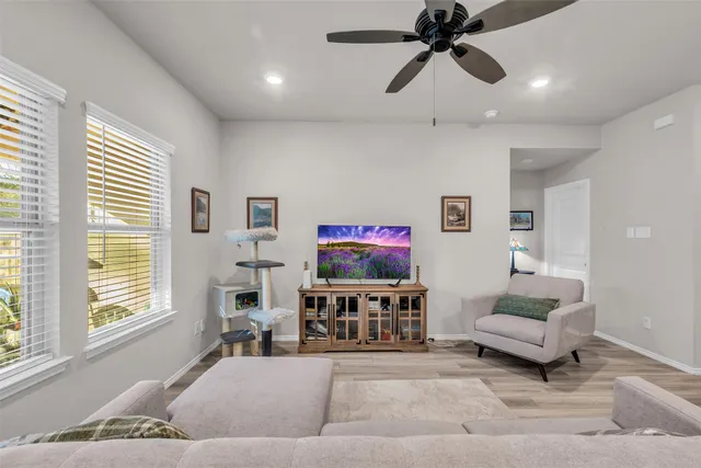 a bedroom with a bed and a tv