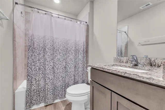 a bedroom with a bed and a cabinets