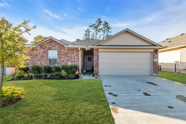 a house with a big yard and large trees