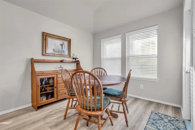 a view of a hallway with paintings on the wall