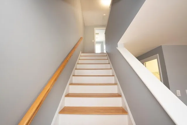 a bathroom with a sink toilet and a mirror