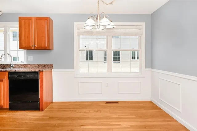 a view of a kitchen with an empty space and a window