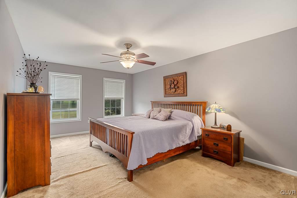 114 Peggy Lane Nazareth, PA 18064 - Photo 40 of 50 a bedroom with a bed and a chandelier
