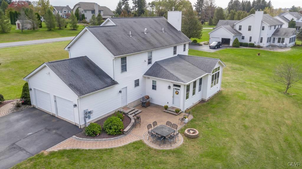 114 Peggy Lane Nazareth, PA 18064 - Photo 6 of 50 a aerial view of a house with a yard and large trees