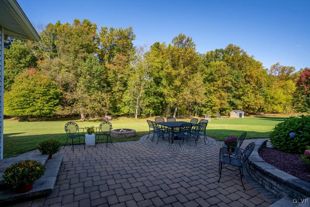 114 Peggy Lane Nazareth, PA 18064 - Photo 8 of 50 a view of a swimming pool and lounge chairs in back yard
