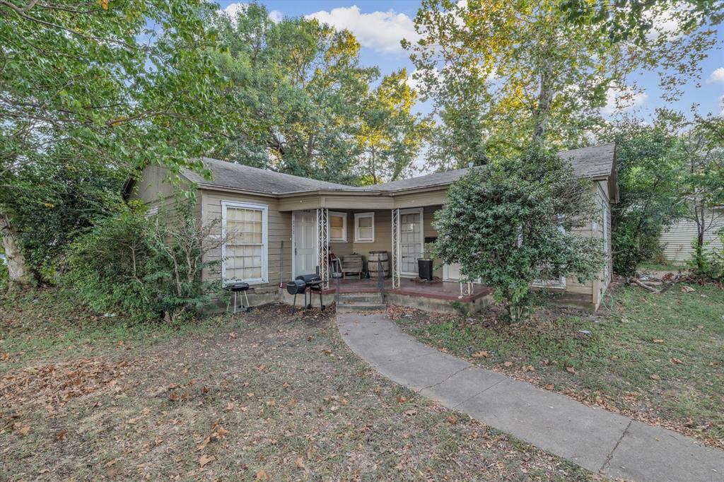 3412 Brook Circle Waco, TX 76710 - Photo 3 of 16 a view of a house with a yard and sitting area
