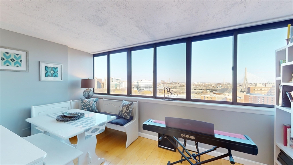 8 Whittier Place, Unit 16BFURNISH Boston, MA 02114 - Photo 1 of 7 a view of a workspace with furniture and a window