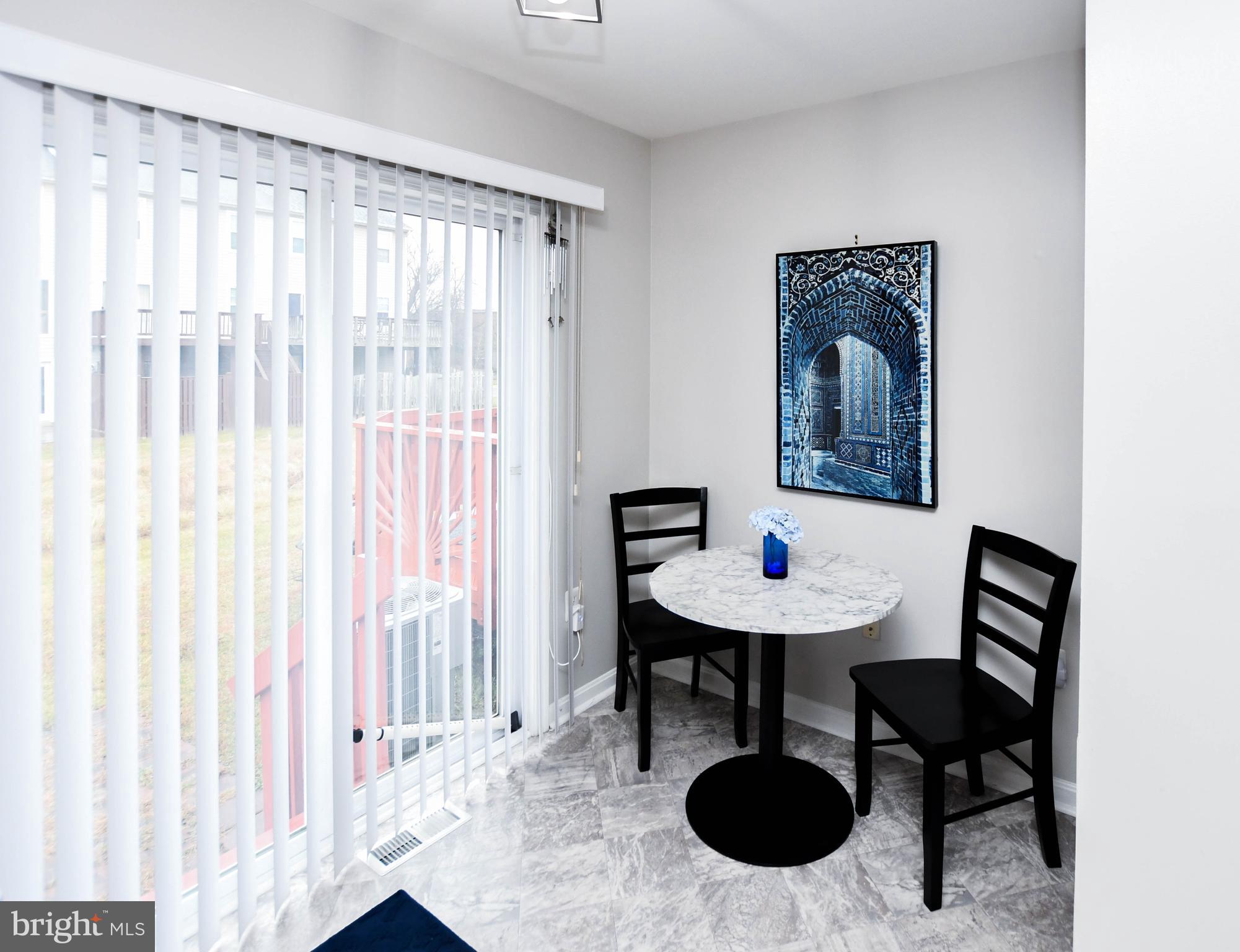 5534 Rockfish Way Clinton, MD 20735 - Photo 12 of 49 a view of a room with a table and chairs