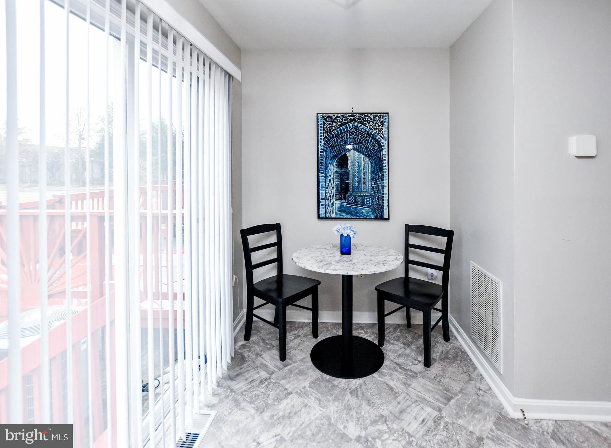 5534 Rockfish Way Clinton, MD 20735 - Photo 20 of 49 a dining room with furniture and a window