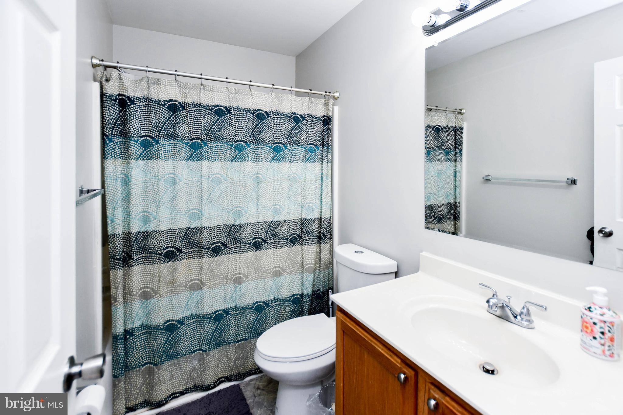 5534 Rockfish Way Clinton, MD 20735 - Photo 28 of 49 a bathroom with a sink and a mirror