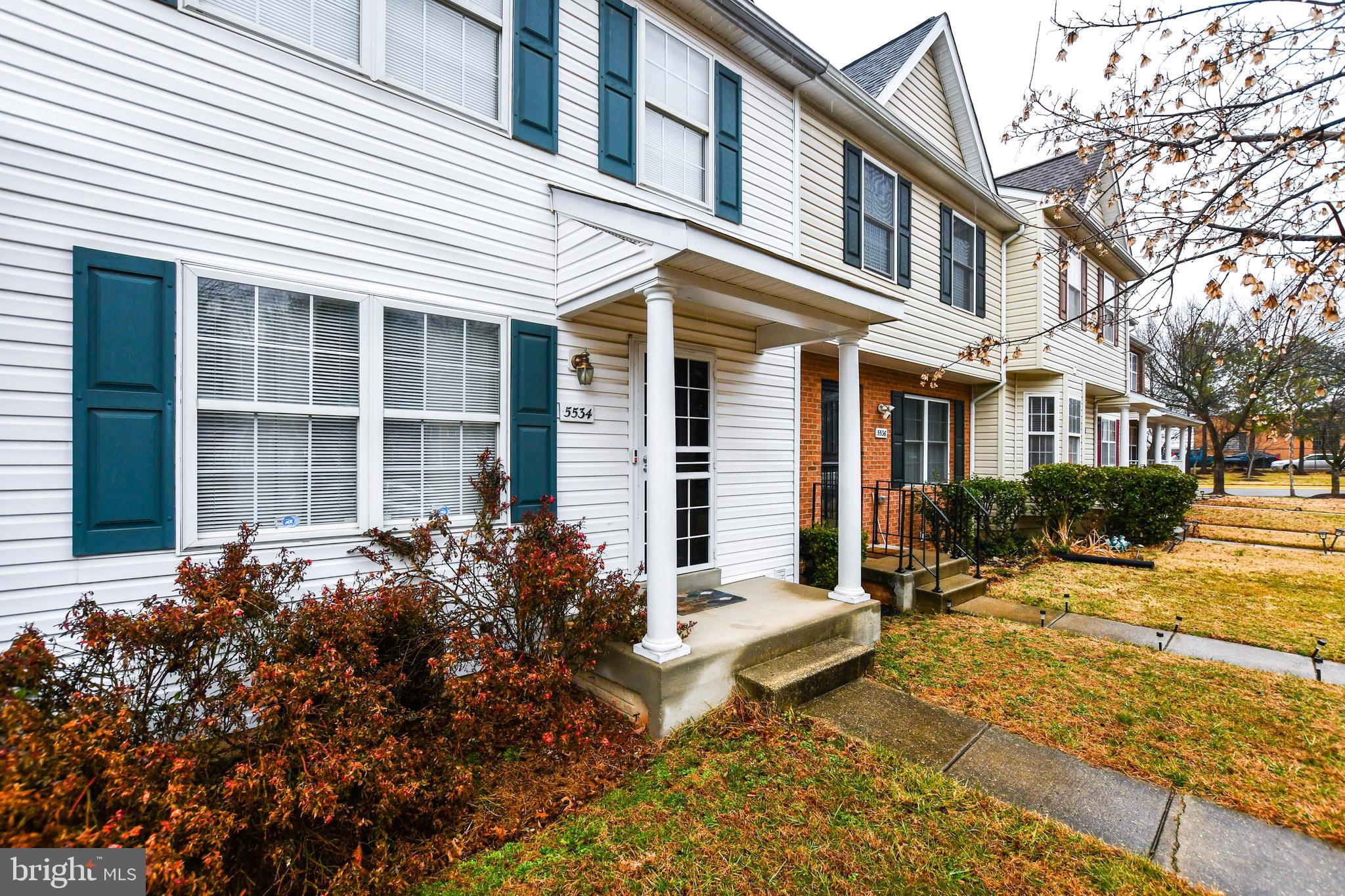 5534 Rockfish Way Clinton, MD 20735 - Photo 3 of 49 a view of a house with a small yard and plants