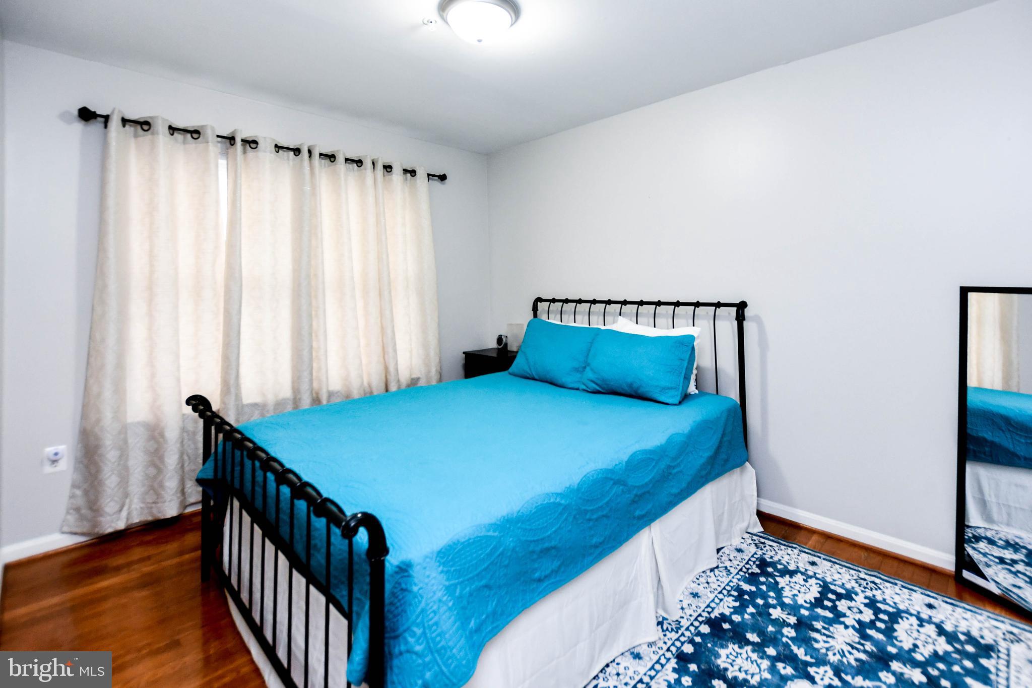 5534 Rockfish Way Clinton, MD 20735 - Photo 35 of 49 a bedroom with a bed and a window