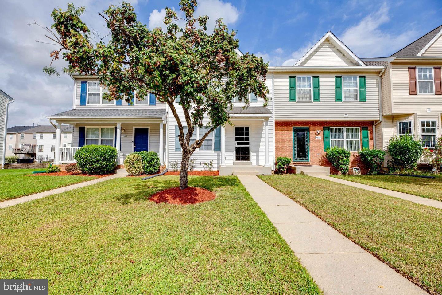 5534 Rockfish Way Clinton, MD 20735 - Photo 49 of 49 a front view of a house with yard and green space