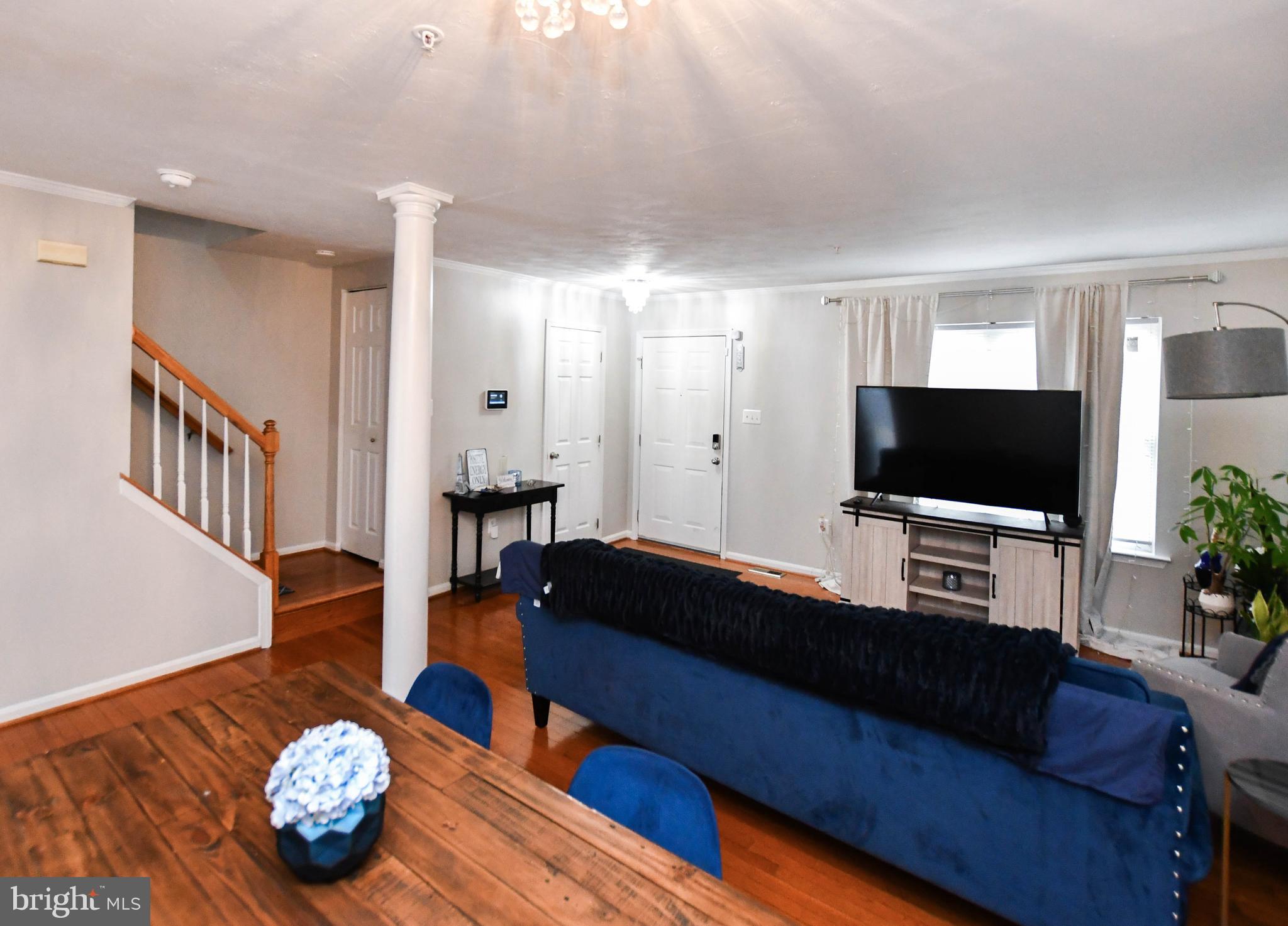 5534 Rockfish Way Clinton, MD 20735 - Photo 9 of 49 a living room with furniture and a flat screen tv