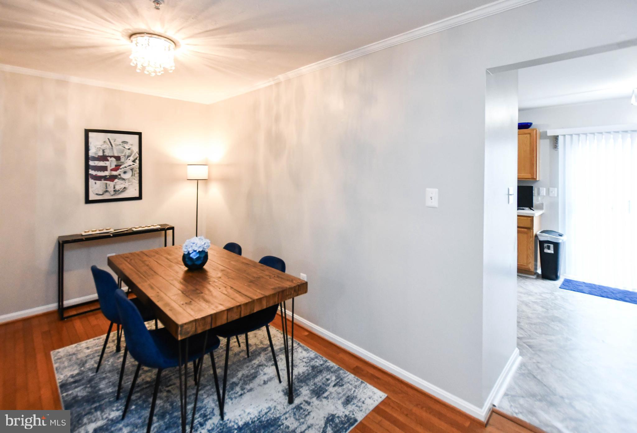 5534 Rockfish Way Clinton, MD 20735 - Photo 10 of 49 a view of a workspace with furniture and wooden floor