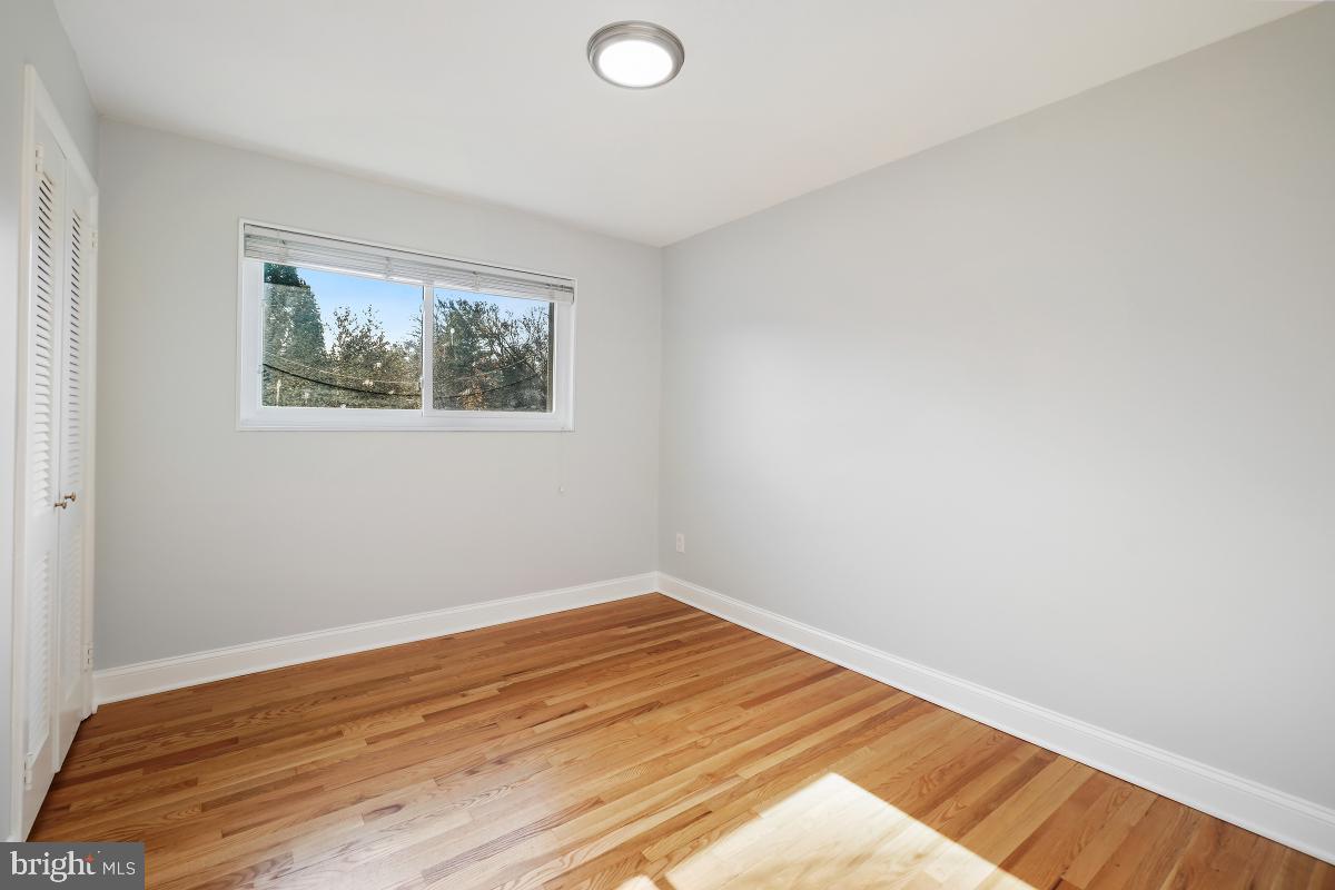 11514 Yates Street Silver Spring, MD 20902 - Photo 17 of 30 a view of a room with wooden floor and window