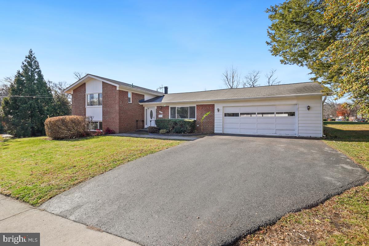 11514 Yates Street Silver Spring, MD 20902 - Photo 2 of 30 a front view of a house with a yard