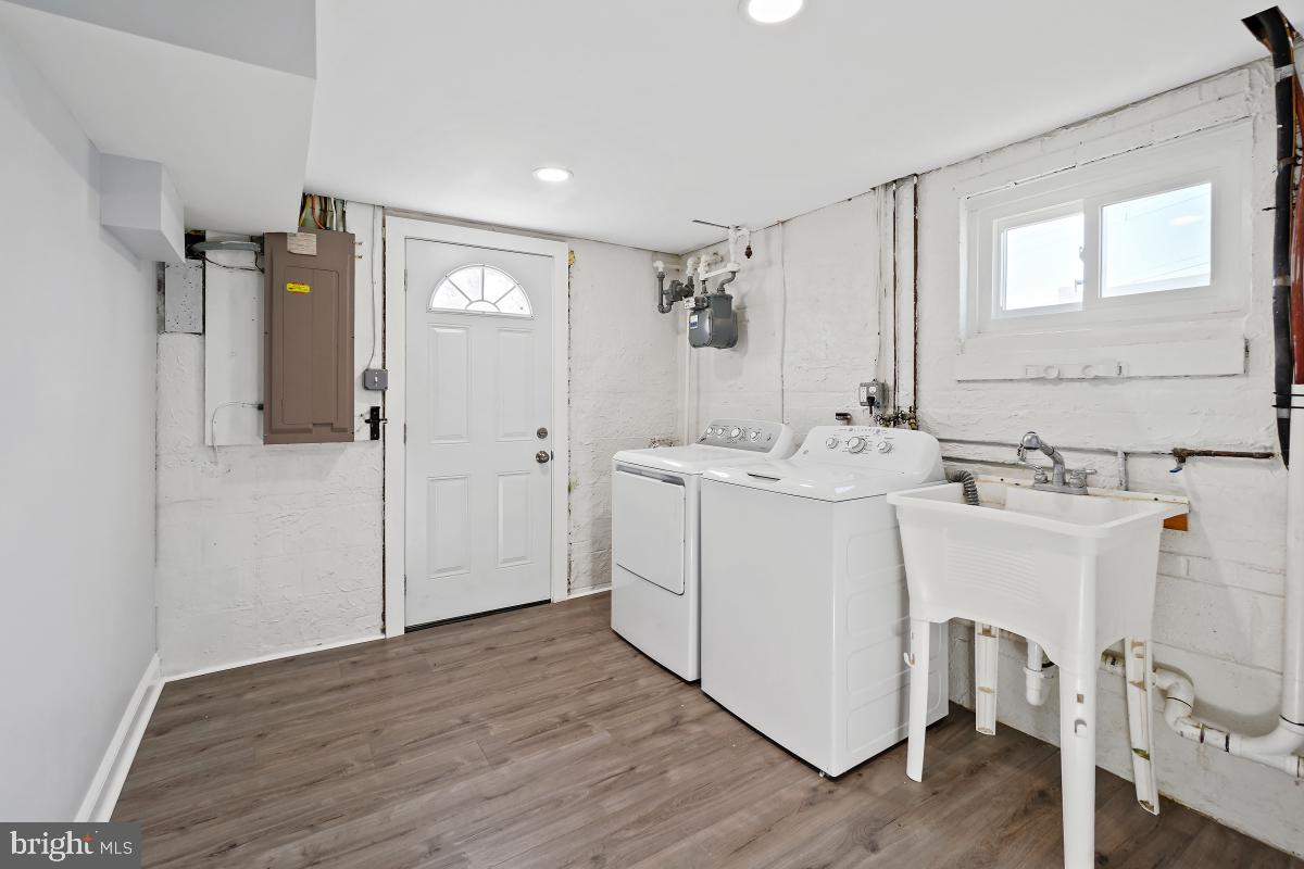 11514 Yates Street Silver Spring, MD 20902 - Photo 25 of 30 a bathroom with a double vanity sink mirror and shower