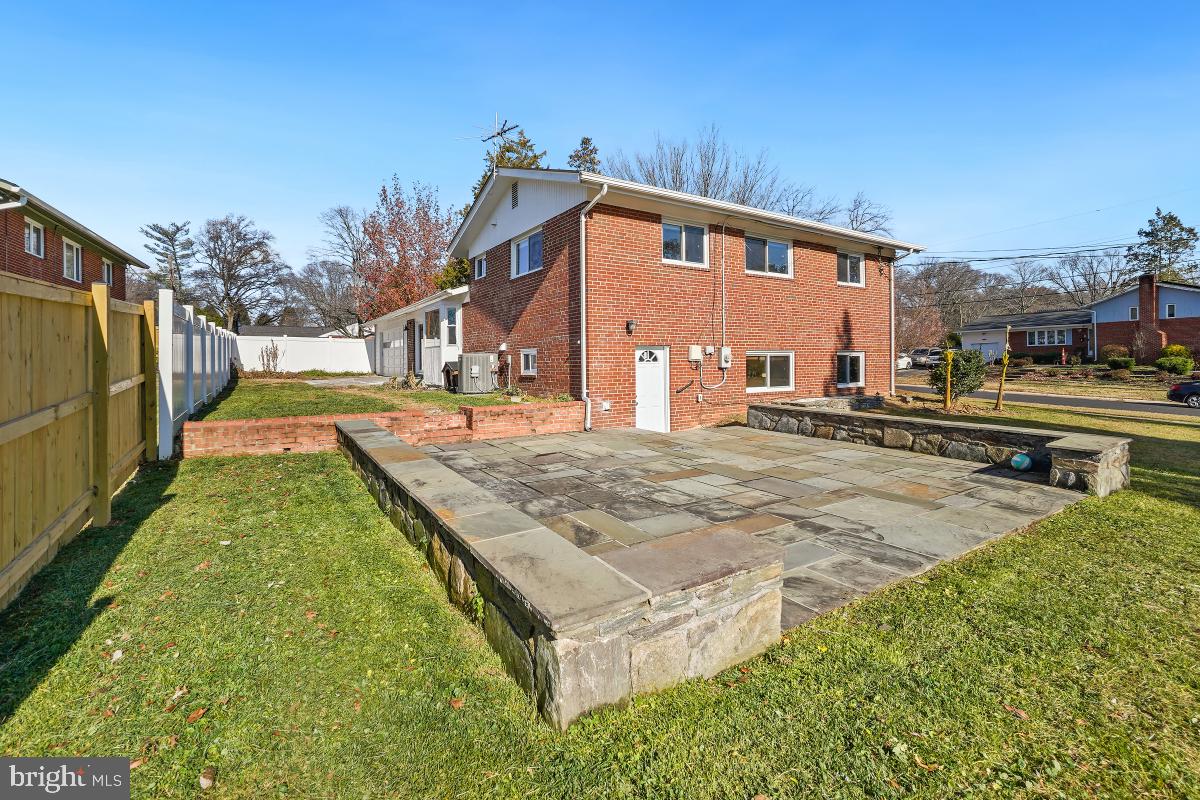 11514 Yates Street Silver Spring, MD 20902 - Photo 29 of 30 a view of a house with a yard