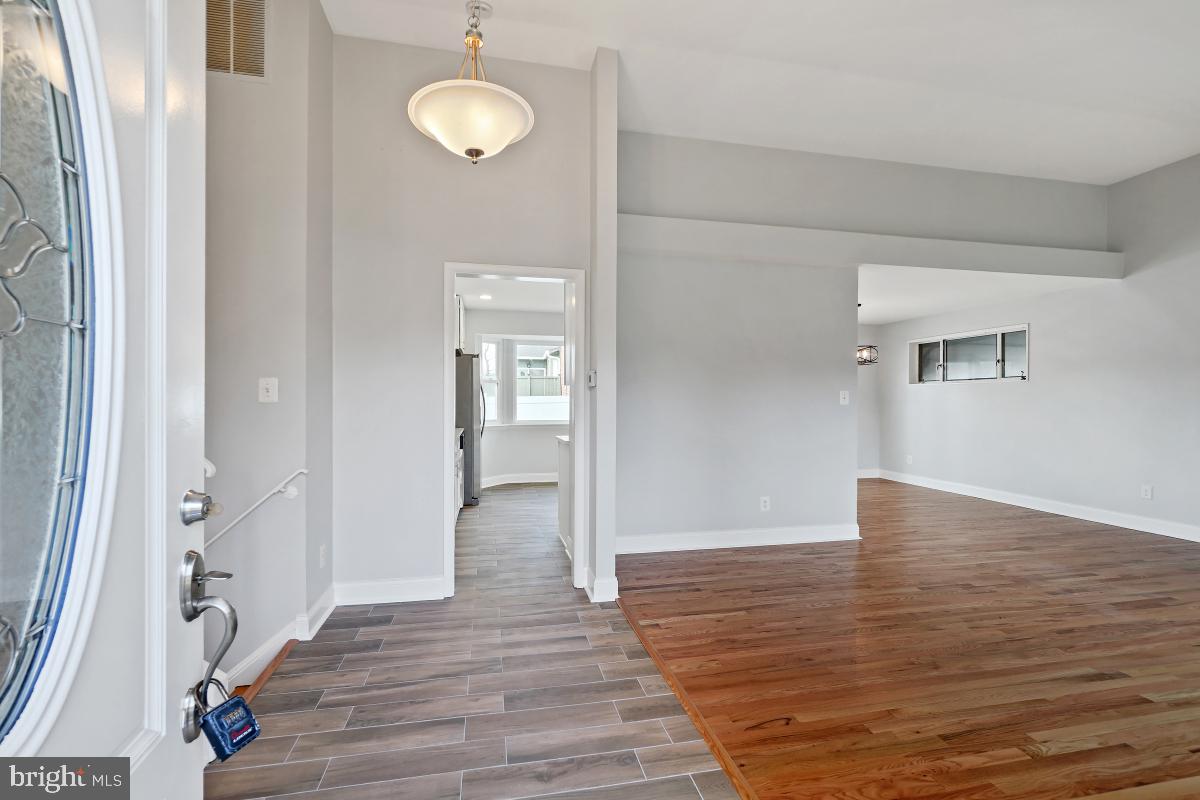 11514 Yates Street Silver Spring, MD 20902 - Photo 4 of 30 a view of a room with wooden floor