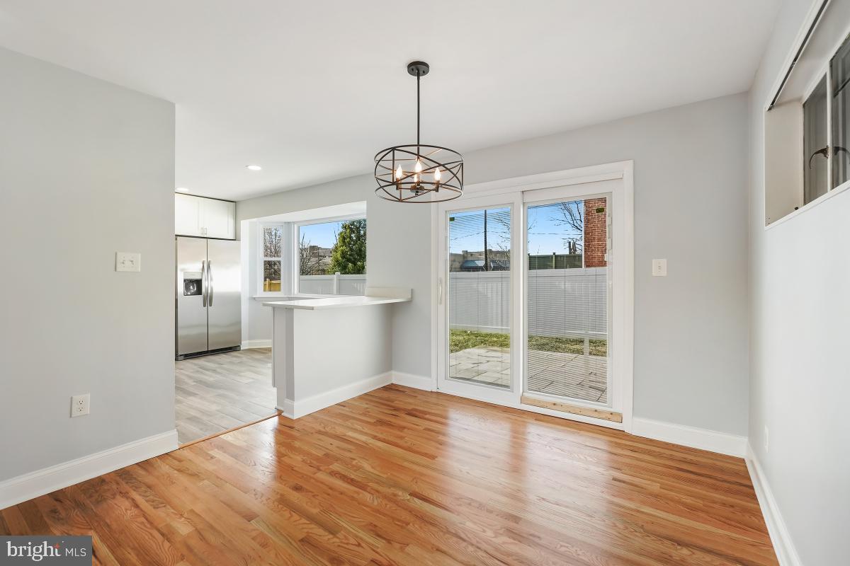 11514 Yates Street Silver Spring, MD 20902 - Photo 8 of 30 a view of a kitchen with wooden floor and a kitchen