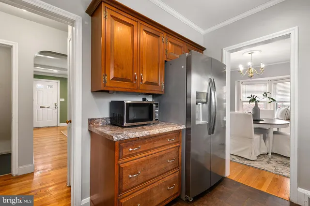 a kitchen with granite countertop a sink and a window