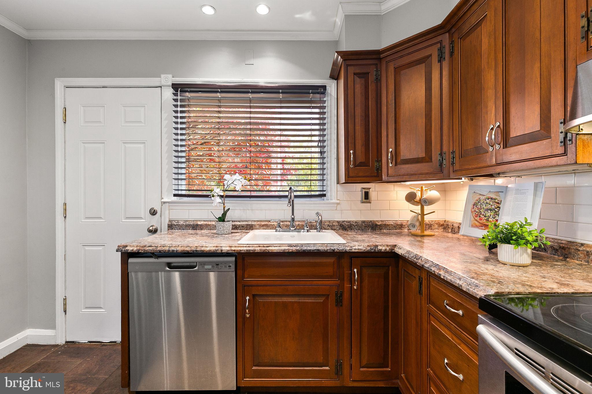 1860 Loch Shiel Road Towson, MD 21286 - Photo 12 of 58 a kitchen with granite countertop a sink and a window