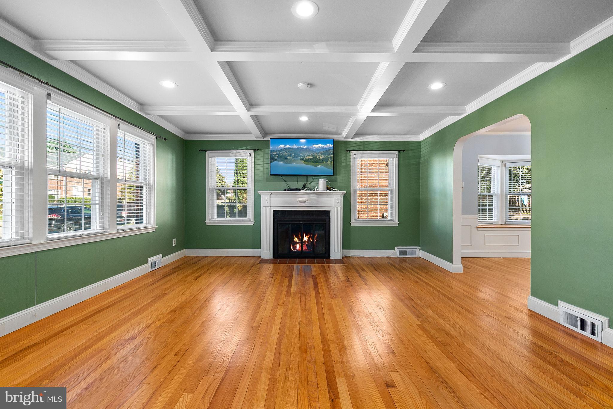 1860 Loch Shiel Road Towson, MD 21286 - Photo 19 of 58 a view of an empty room with wooden floor fireplace and a window