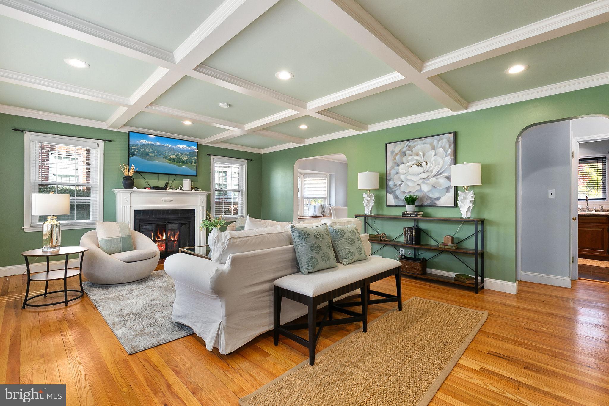 1860 Loch Shiel Road Towson, MD 21286 - Photo 21 of 58 a living room with fireplace furniture and a wooden floor