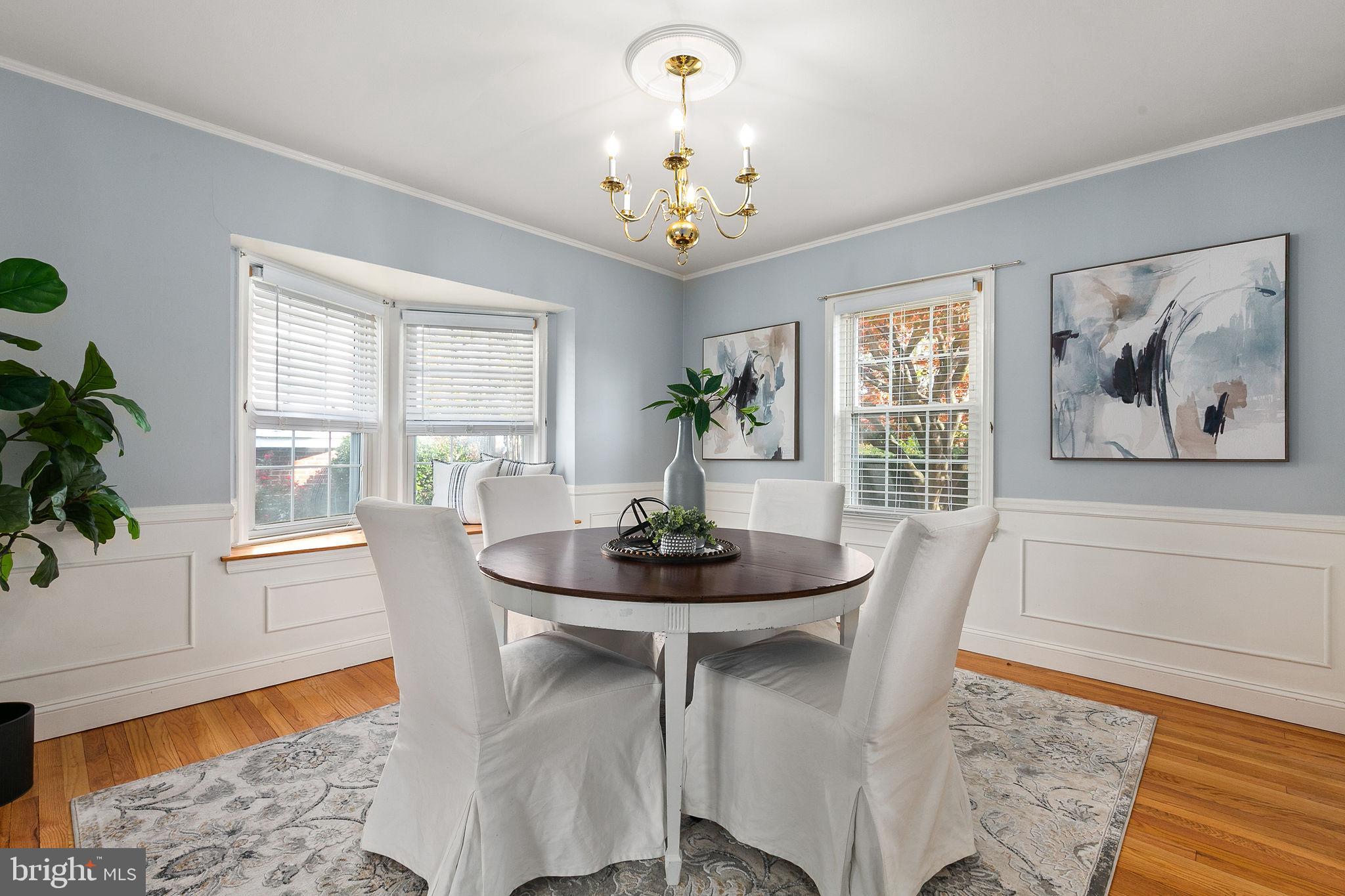 1860 Loch Shiel Road Towson, MD 21286 - Photo 26 of 58 a dining room with furniture a large window and wooden floor