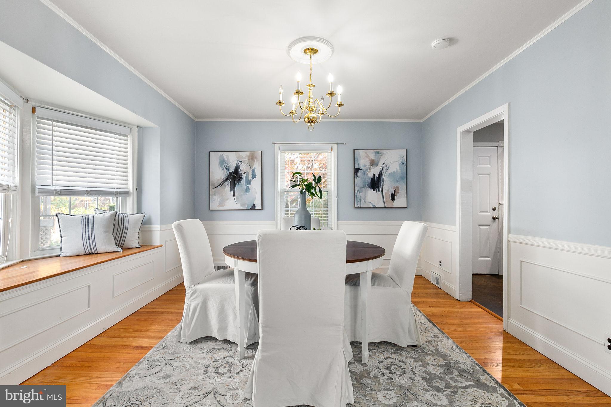 1860 Loch Shiel Road Towson, MD 21286 - Photo 28 of 58 a view of a dining room with furniture a chandelier and wooden floor