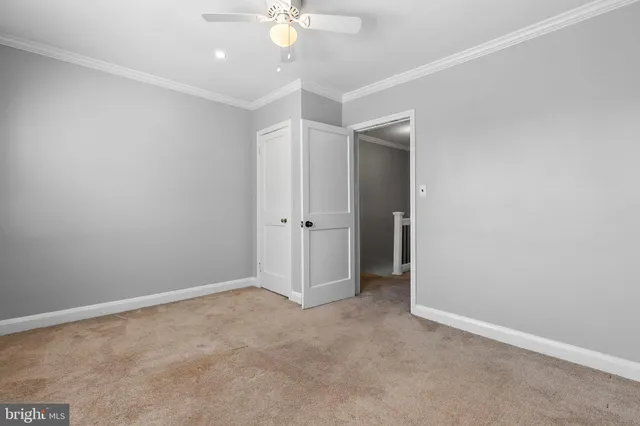a living room with furniture and a a mirror