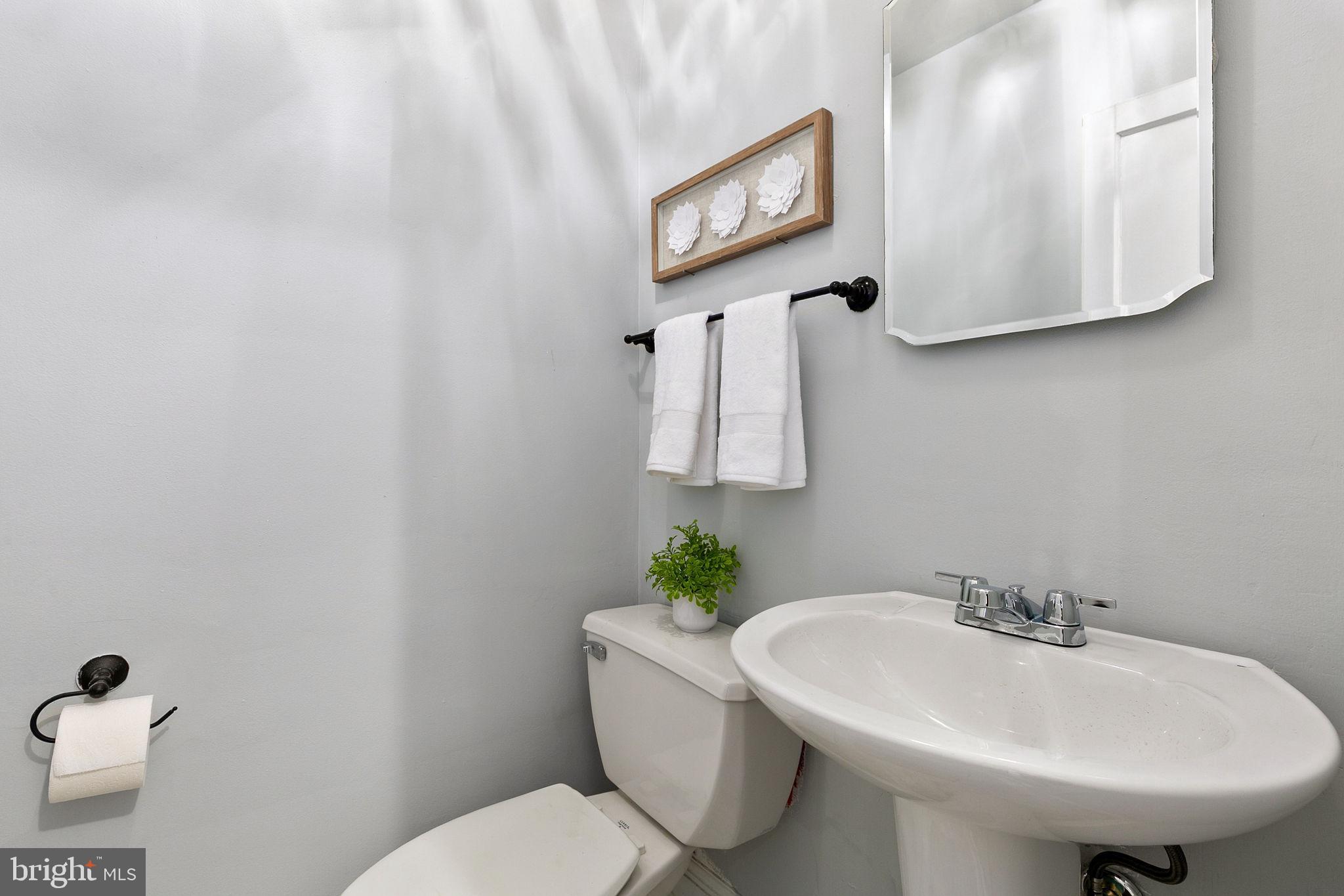 1860 Loch Shiel Road Towson, MD 21286 - Photo 44 of 58 a bathroom with a sink a mirror and a toilet