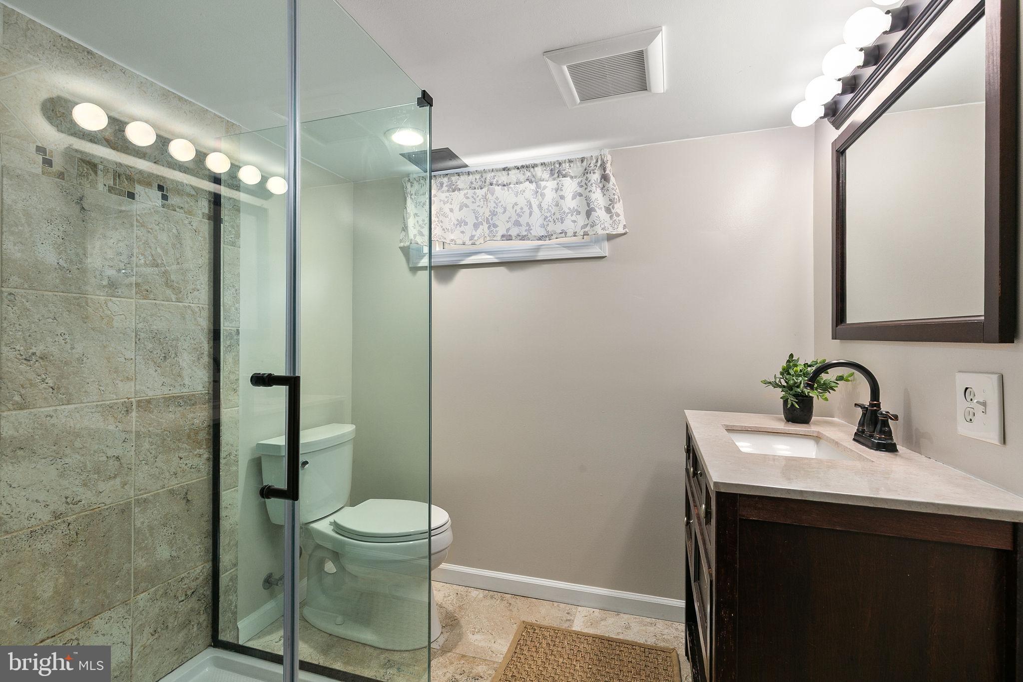 1860 Loch Shiel Road Towson, MD 21286 - Photo 49 of 58 a bathroom with a sink a toilet and shower