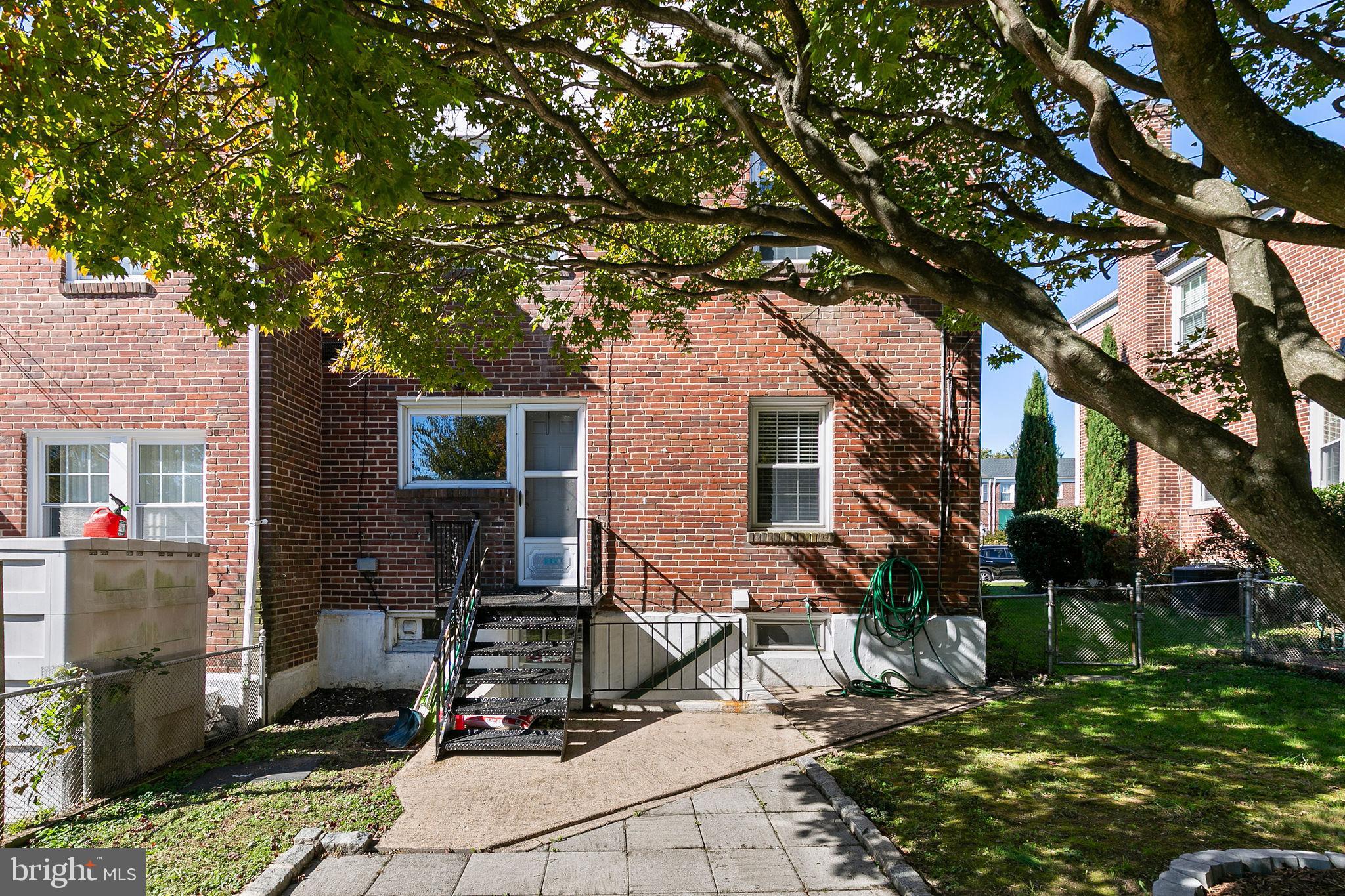 1860 Loch Shiel Road Towson, MD 21286 - Photo 58 of 58 a view of house with backyard outdoor seating and trees