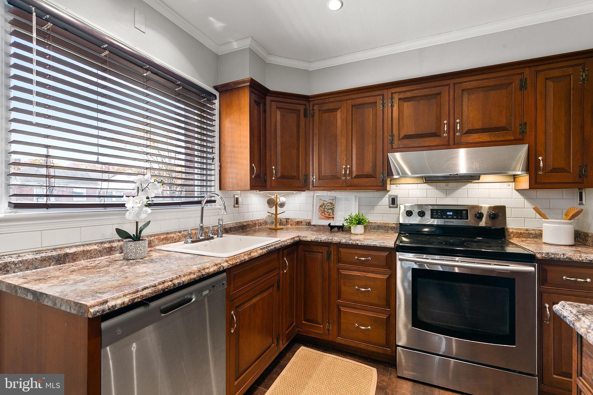 1860 Loch Shiel Road Towson, MD 21286 - Photo 6 of 58 a kitchen with a stove and a sink