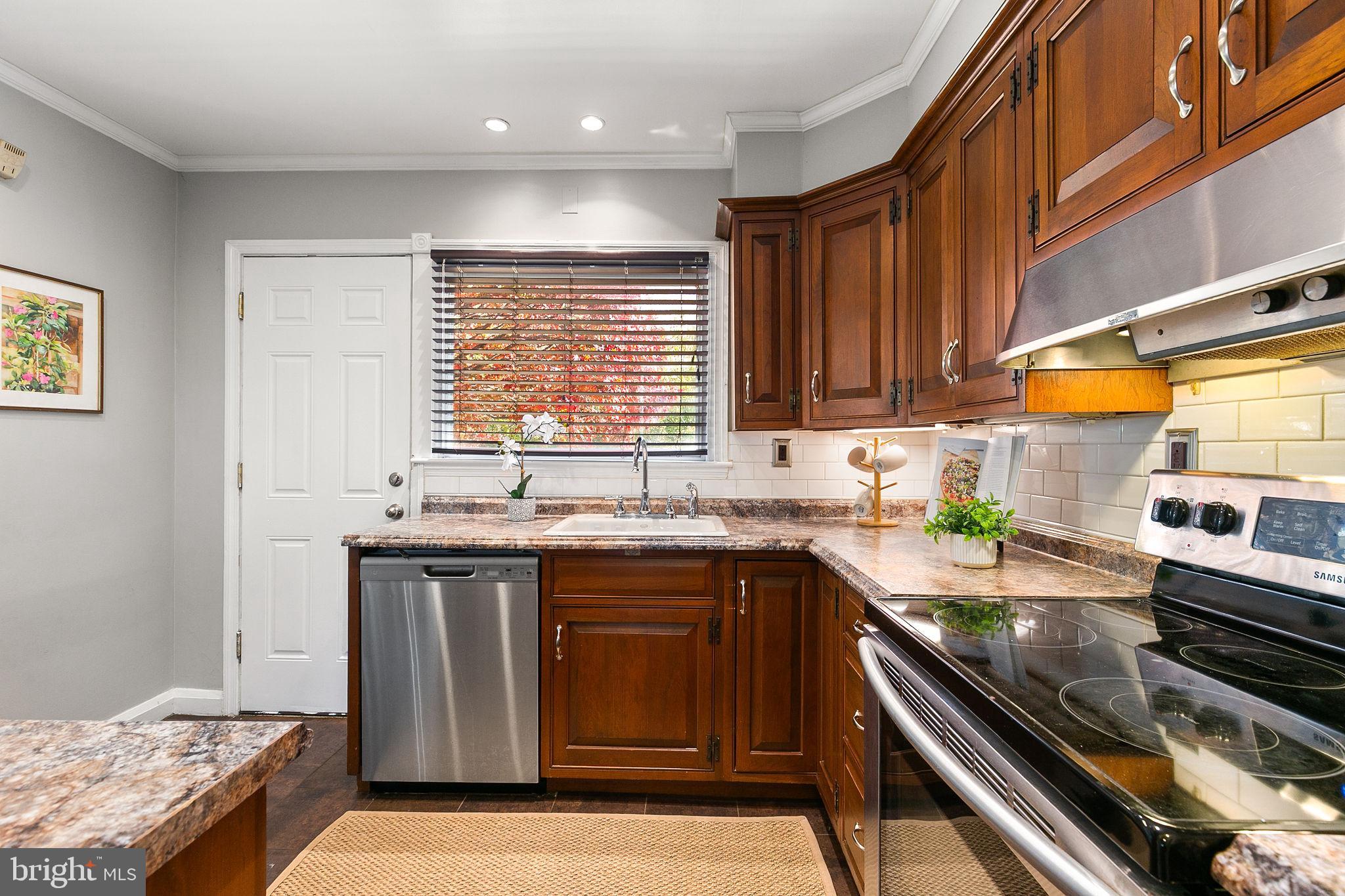1860 Loch Shiel Road Towson, MD 21286 - Photo 9 of 58 a kitchen with a sink stove top oven and cabinets