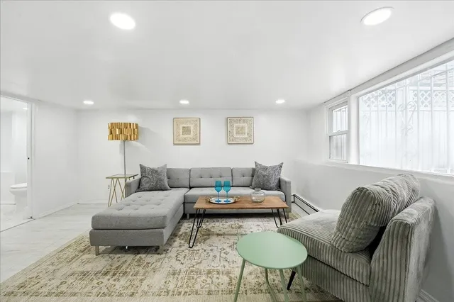 a living room with furniture and a window