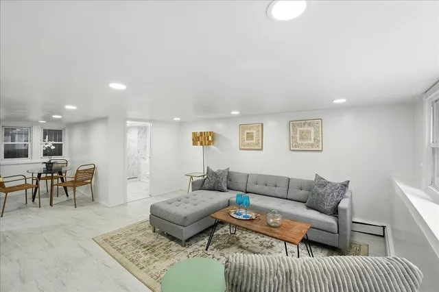 a living room with furniture and a couch