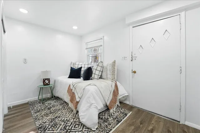 a bed room with a bed and a window