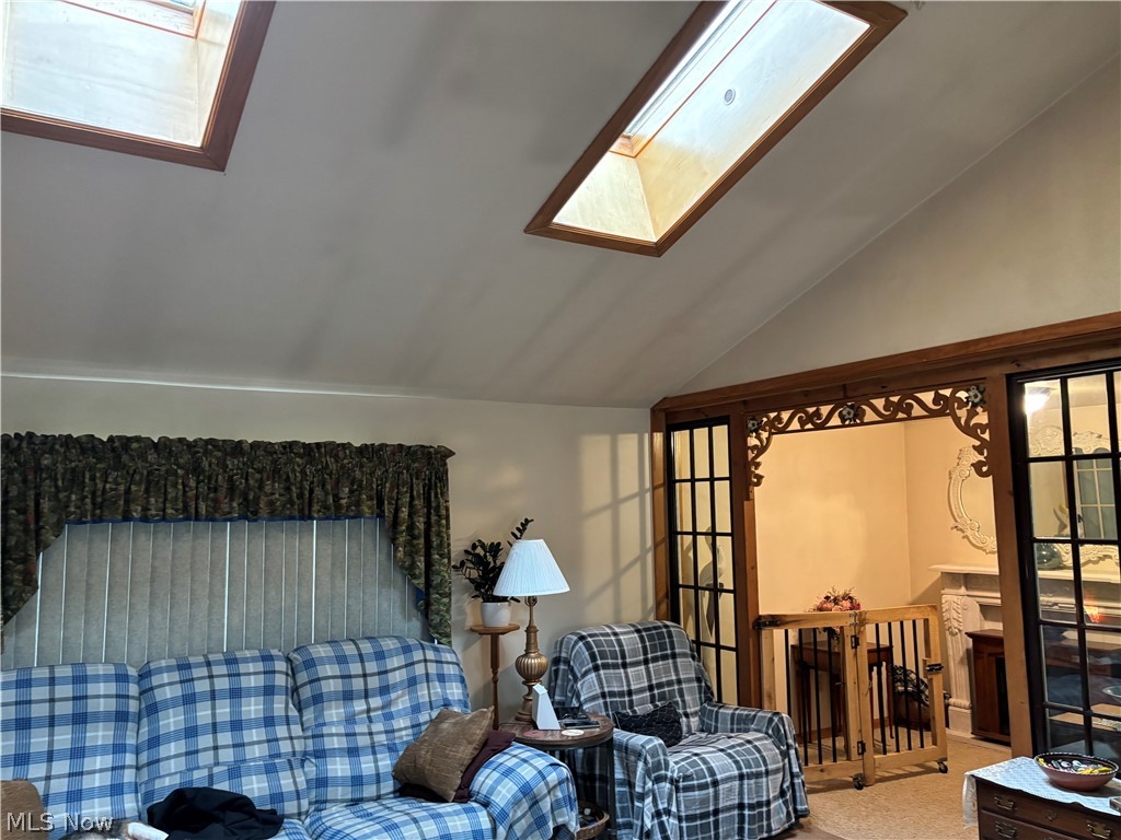 2417 Mc Adoo Ridge Road Wellsburg, WV 26070 - Photo 7 of 33 Carpeted living room with vaulted ceiling with skylight