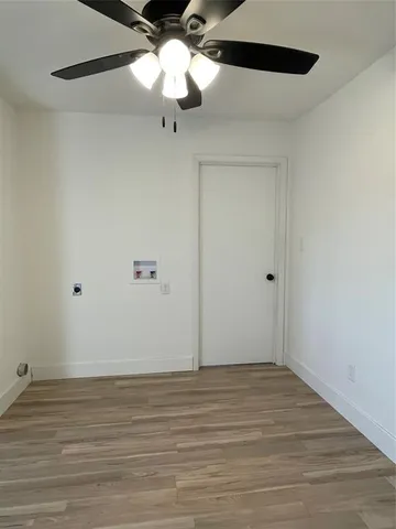 a view of a yard with a large tree