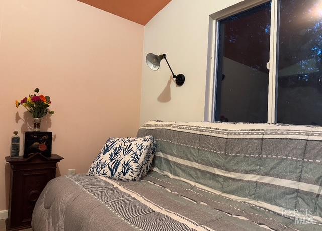 6651 Hearst Willits Road Willits, CA 95490 - Photo 5 of 11 a bedroom with a bed and a window