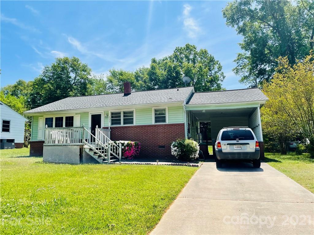 1335 Westwood Road Lancaster, SC 29720 - Photo 2 of 2 a front view of a house with garden