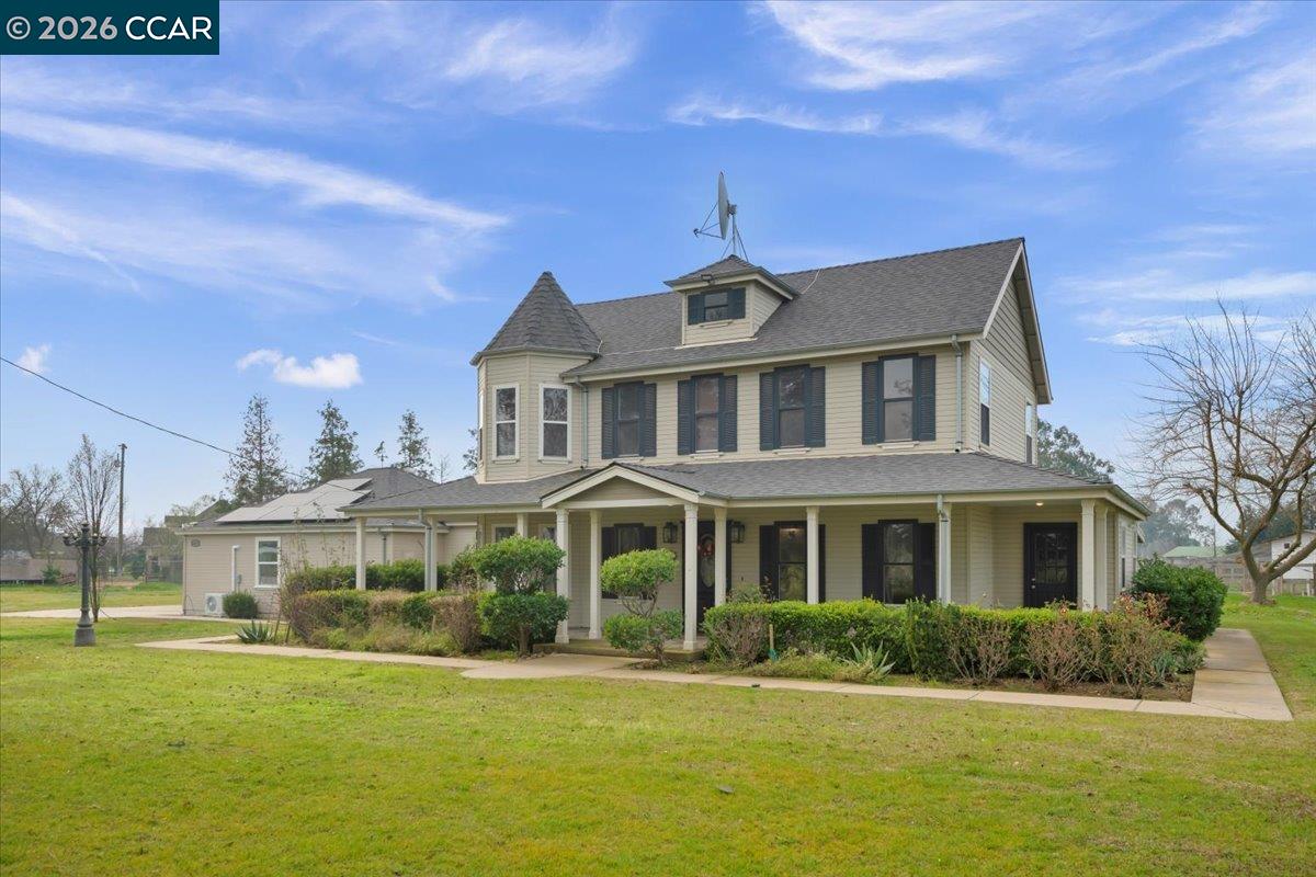24685 Fuhrman Road Acampo, CA 95220 - Photo 1 of 58 a front view of a house with a yard