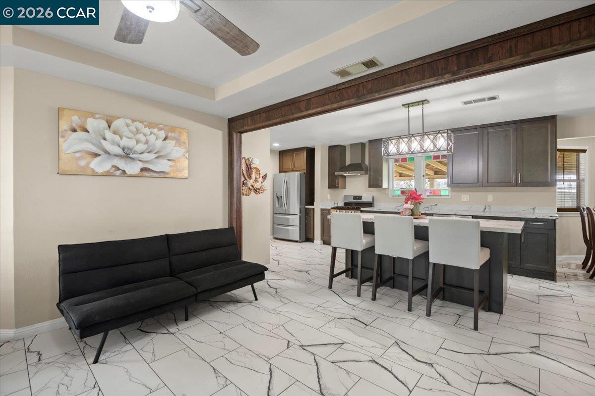 24685 Fuhrman Road Acampo, CA 95220 - Photo 16 of 58 a living room with furniture and kitchen view