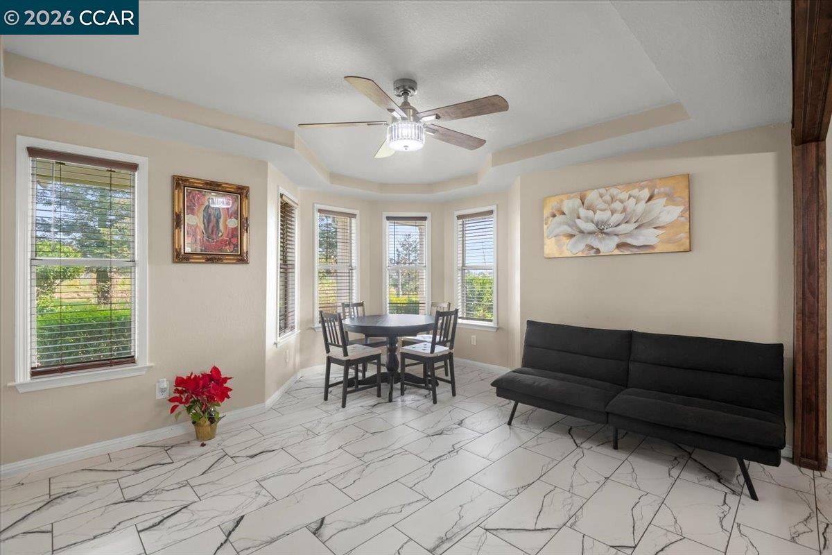24685 Fuhrman Road Acampo, CA 95220 - Photo 17 of 58 a living room with furniture and a potted plant