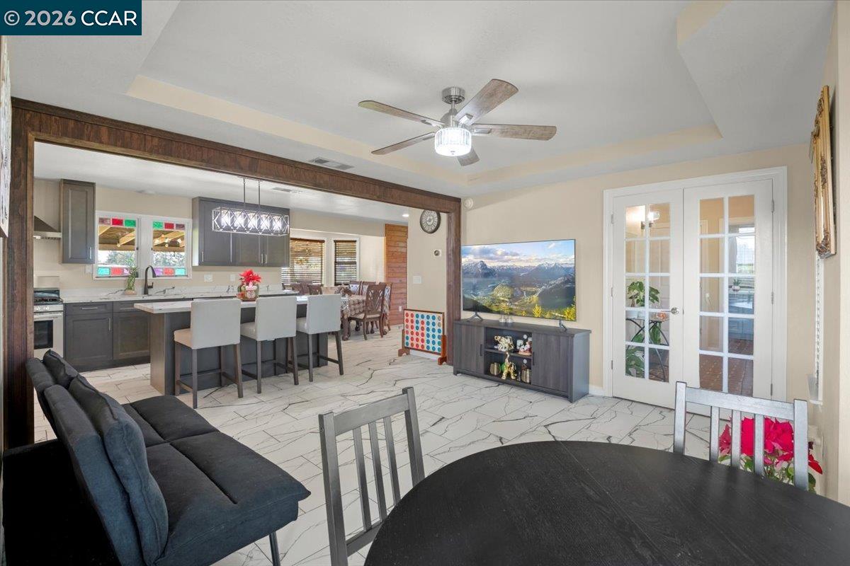 24685 Fuhrman Road Acampo, CA 95220 - Photo 19 of 58 a living room with furniture and a flat screen tv